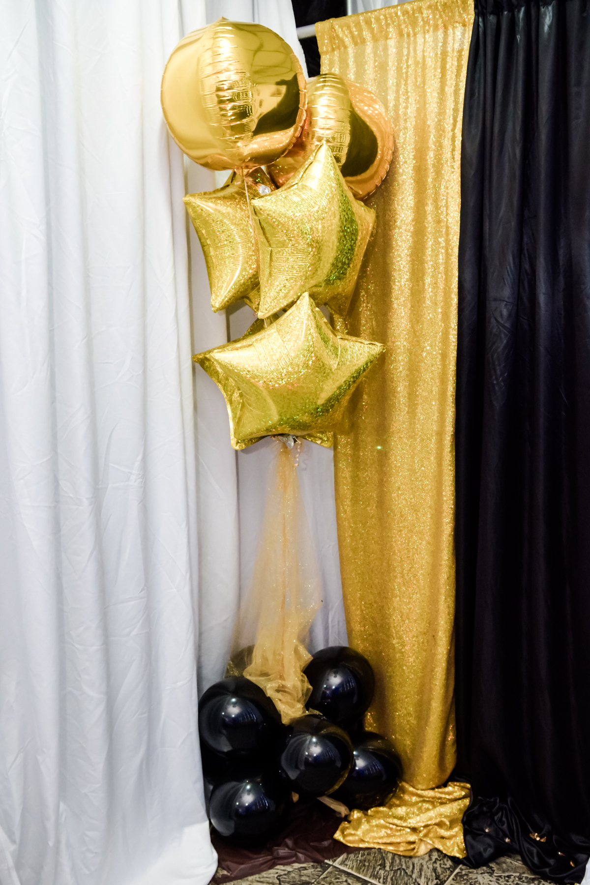 Gold and black Crossroad Family event decor